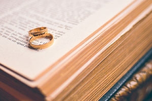 The Essence of CovenantRecently, I participated in a conversion about divorce in the church. While many attribute marital difficulties to communication or the lack thereof, I was of the opinion that a failure to understand the essence of covenant was at the heart of divorce.Covenant is word we often find when studying the Bible or discussing biblical theology. We may reference the new covenant or the old covenant. We may talk about the covenant between God and Abraham or God and Moses. We refer to the New Testament as being under the new covenant, but what exactly is a covenant and what does it mean to you in this modern age?The first thing to understand about covenant is that it was created by God to be holy. It is not to be taken lightly and should only be entered into with the full understanding of its sacred requirements.God holds the sanctity of covenant above nearly all other things. It is covenant that is at the center of our salvation through Christ. It is covenant that defines Christ’s death on the cross. It is the fulfillment of covenant that has redeemed mankind and brought him back to his creator.The English language fails us in many ways when we use it to understand scriptures. Our understanding of covenant is a good example. In Hebrew, the word for covenant means both covenant and testament. This means for us, that we may freely exchange those two English words. For example, the Old Testament and the New Testament are the old covenant and the new covenant and vice-versa.If we are to understand the essence of covenant, we need an English phrase to encompass its true meaning. The phrase "binding-agreement-upon-death" comes fairly close.In English, we separate the words covenant and testament with two separate meanings. The English definition for a covenant is an agreement. The English definition for testament is a document or a statement which commonly comes into effect upon death.This is how we come to the phrase, last will and testament. At the reading of a will, the final wishes of a deceased person is read aloud and carried out. The testament therefore becomes effective only after the person’s death. This is the critical component of a covenant – to enter into covenant, a death is required! There is no way around this. If you do not have a death, you cannot enter into covenant.When we combine these two English definitions, we come close to the essence of God’s covenant – a binding agreement that becomes effective upon death.The first time we see covenant in scripture is when God enters into covenant with Abram in Genesis Chapter 15.Gen 15:9 "And he said unto him, Take me an heifer of three years old, and a she goat of three years old, and a ram of three years old, and a turtledove, and a young pigeon."Gen 15:10 "And he took unto him all these, and divided them in the midst, and laid each piece one against another: but the birds divided he not."In verse nine, God tells Abram to gather together a heifer, a goat, and a ram. He then has Abram sacrifice the animals and cut their carcasses into two halves by dividing them.Later in verses 17-18 we see the Spirit of God pass between the animal carcass halves and enter into a covenant with Abram.Gen 15:17 "And it came to pass, that, when the sun went down, and it was dark, behold a smoking furnace, and a burning lamp that passed between those pieces."Gen 15:18 "In the same day the LORD made a covenant with Abram, saying, Unto thy seed have I given this land, from the river of Egypt unto the great river, the river Euphrates:"What we’re seeing in these verses is the creation of covenant. By passing between the halves of the sacrificed animals, God has "sealed" His agreement with Abram with death. That is the essence of covenant – a binding agreement upon death.We see this act of covenant again when God asks Abraham to sacrifice his son Isaac. Though God stays Abraham’s hand at the last second, in his heart Abraham fulfilled his responsibility to God by sacrificing his son. Upon this act, Abraham entered into a new covenant with God.God fulfills His responsibility to this new covenant with Abraham by sacrificing His son Jesus on the cross. Upon Jesus’ death, the new covenant or New Testament goes into effect. Again, we see that a covenant is a binding agreement upon death.The application of a covenant is a solemn and holy act in which God places great importance. Throughout the history of the nation of Israel, God holds the sanctity of covenant above all other agreements and considers the breaking of covenant one of the greatest sins. When did God unleash His wrath upon Israel? When she broke her covenant with God and worshiped false gods and idols.The covenant between God and Israel is like a spiritual marriage. The new covenant is like a marriage too with Jesus as the bride groom and the church as the bride. A marriage between a man and woman is a mirror image of God’s covenant and so, marriage is much more than just vows. It is a holy commitment that binds two people in a covenant that becomes effective upon death, but what death? – the death of self.The essence of covenant in marriage is to give up your life, or to die to yourself, so that your life becomes your spouses’. From the moment you enter into a covenant of marriage, your life is no longer yours but now belongs to your spouse for you have died to yourself. This is the death that seals a marriage in covenant.While I agree with those that say communication is important to a marriage, I believe it is a failure to understand the essence of covenant that is at the heart of the divorce rate we see in the church.